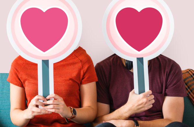 a couple with a heart sign